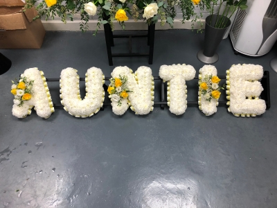 Auntie lettering yellow and white