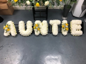 Auntie lettering yellow and white